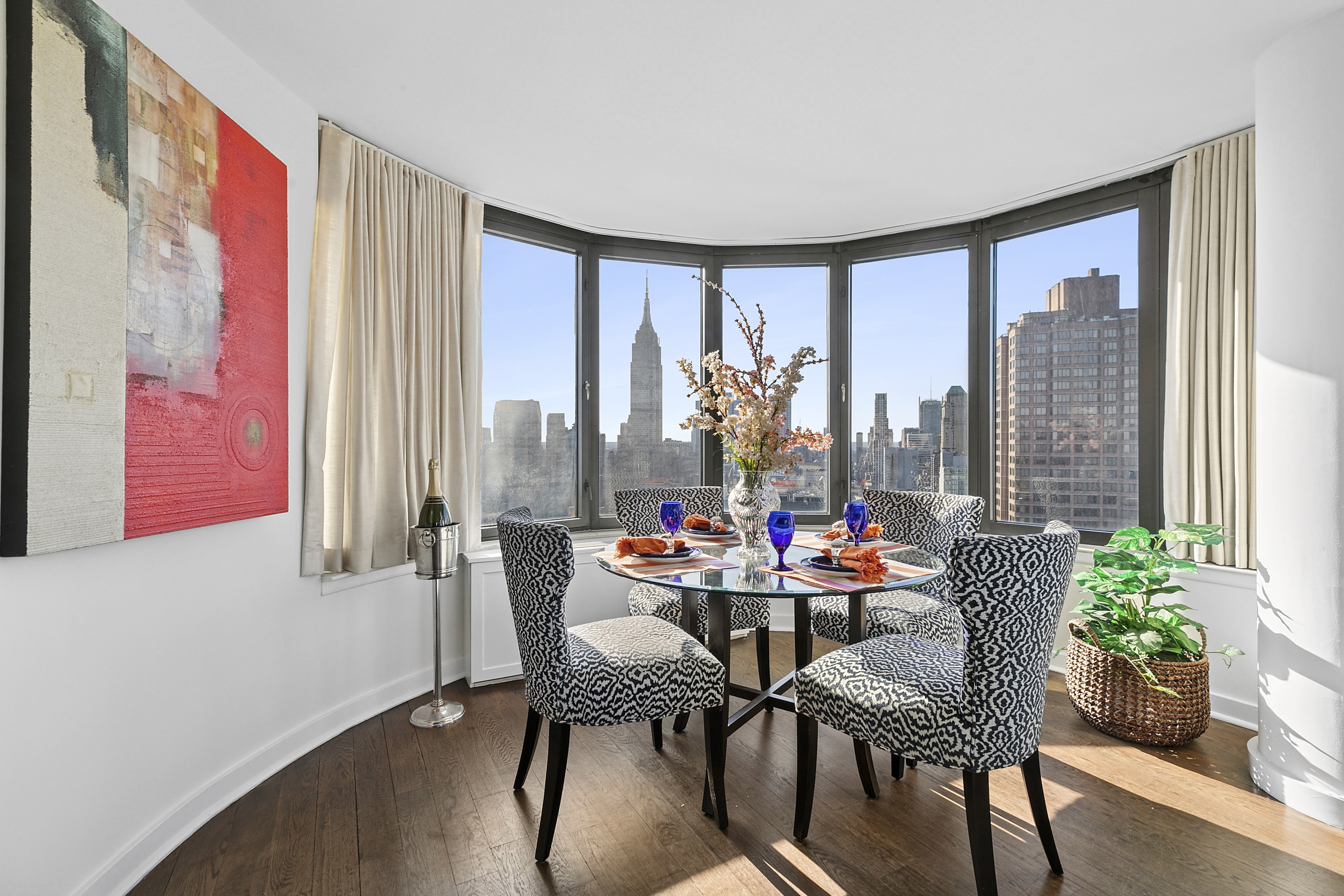 330 East 38th Street, Unit 50E Manhattan, NY 10016 - Photo 2 of 8 a dining room with furniture and wooden floor
