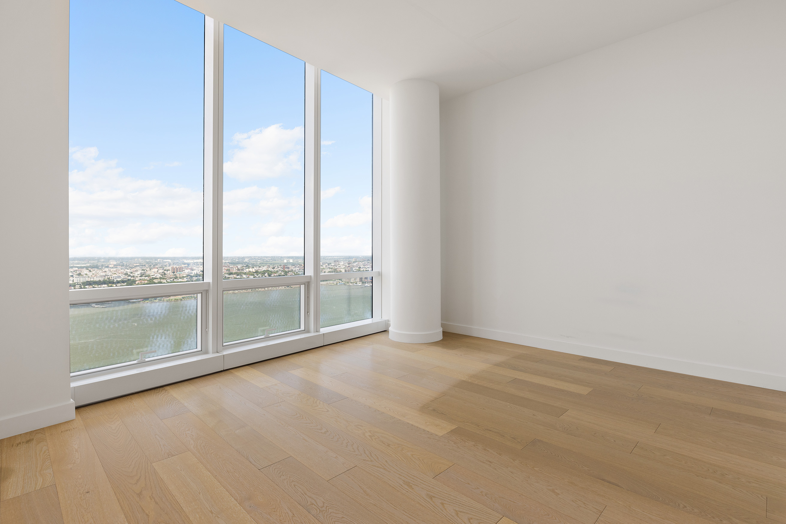 15 Hudson Yards, Unit 68C Manhattan, NY 10001 - Photo 9 of 16 a view of an empty room with a balcony