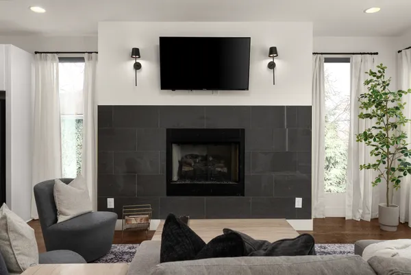 a living room with furniture and a flat screen tv