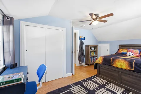 a bedroom with furniture and a window