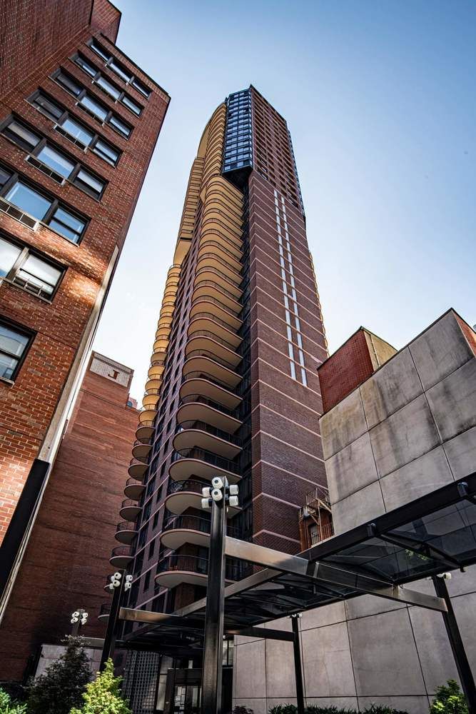 304 East 65th Street, Unit 14D Manhattan, NY 10065 - Photo 13 of 14 a view of balcony with wooden floor