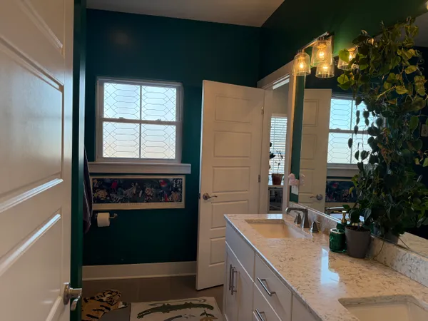 a bathroom with a sink and a mirror