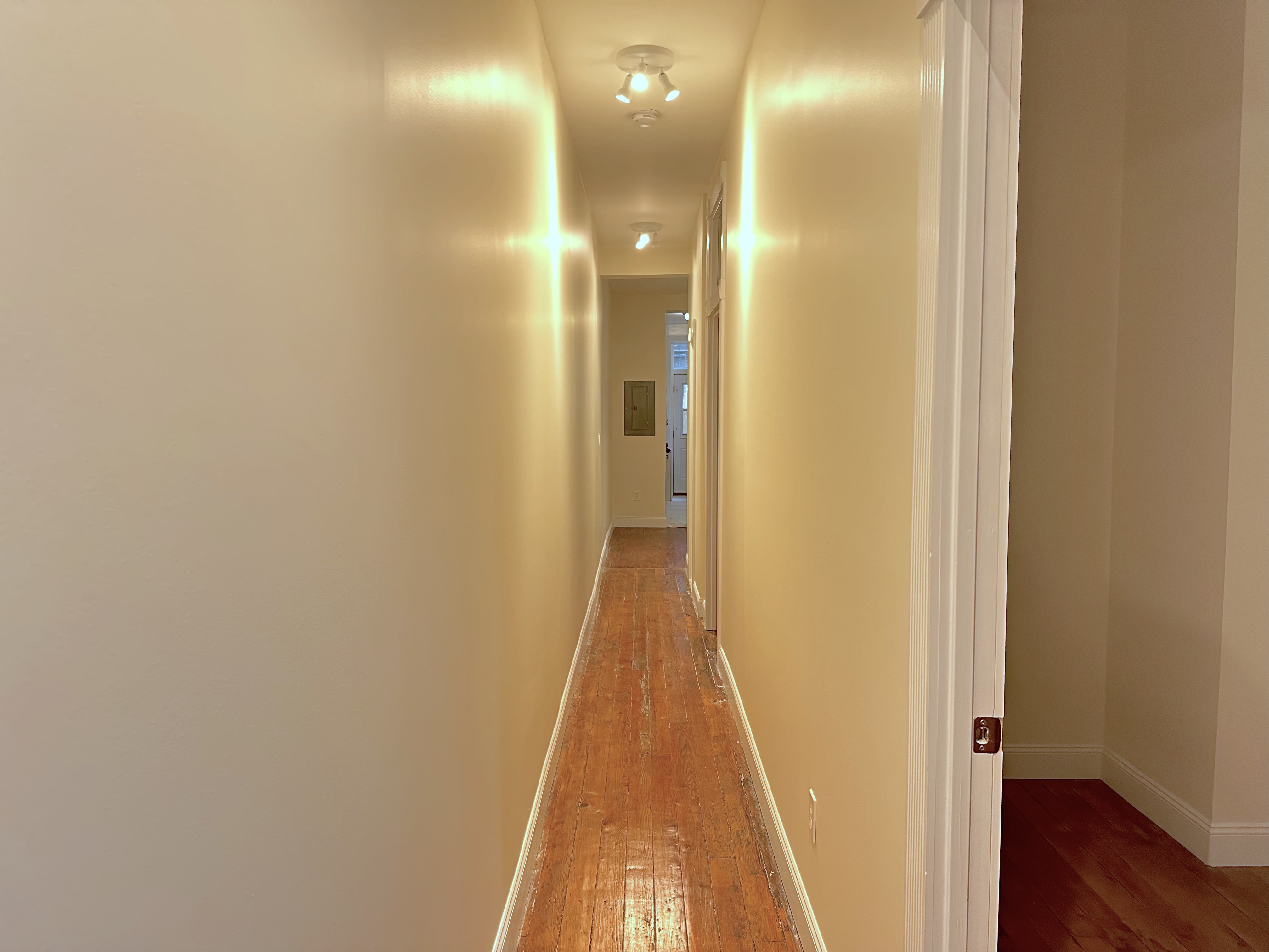 459 West 35th Street, Unit 1E Manhattan, NY 10001 - Photo 5 of 18 a view of a hallway with wooden floor
