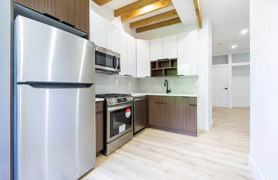180 5th Avenue, Unit 3 Brooklyn, NY 11217 - Photo 5 of 13 a kitchen with stainless steel appliances a refrigerator sink and microwave