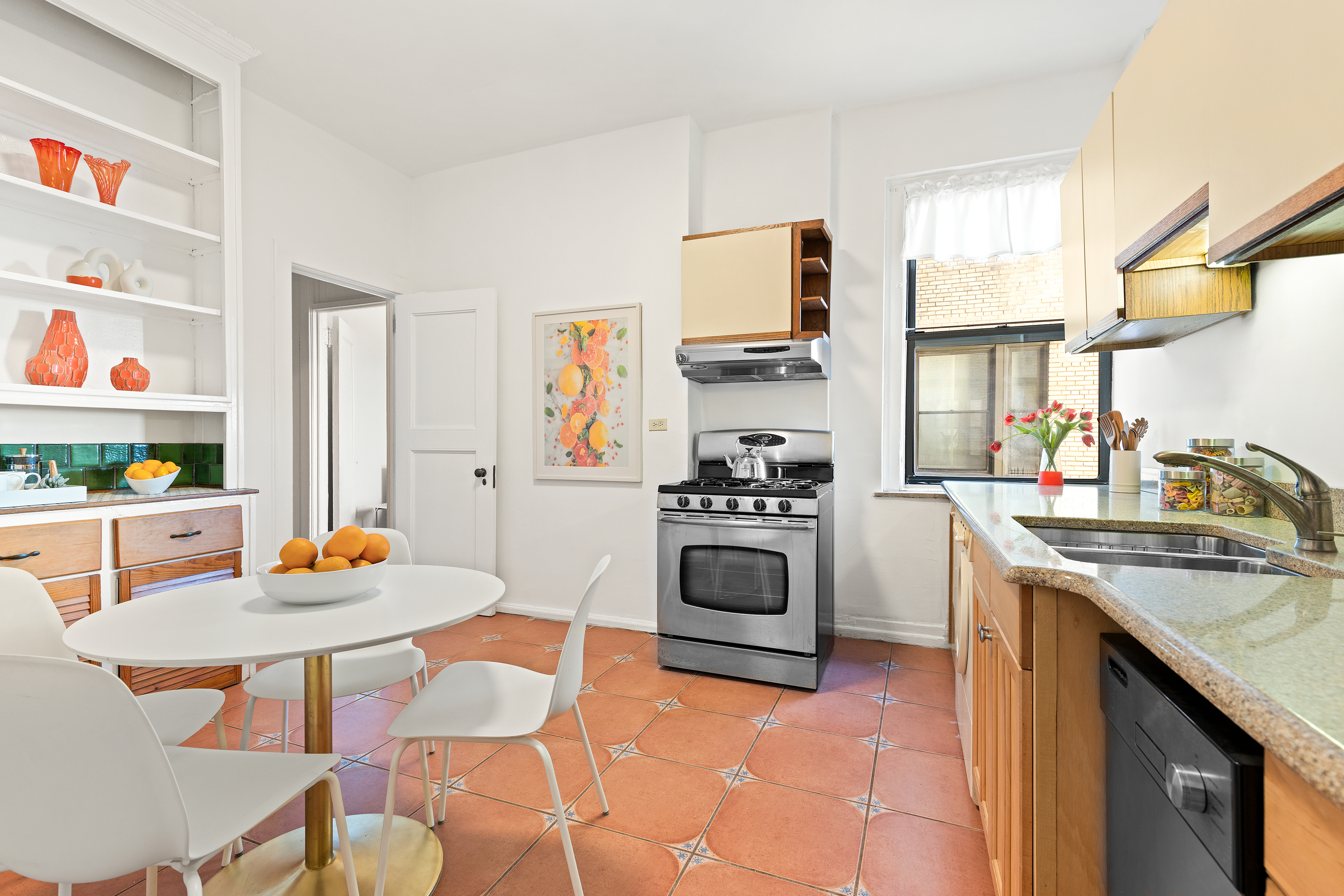 789 West End Avenue, Unit 10C Manhattan, NY 10025 - Photo 8 of 18 a kitchen with stainless steel appliances kitchen island granite countertop a sink stove and white cabinets