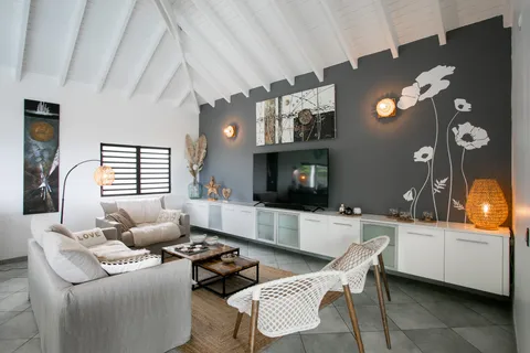 a living room with furniture and a flat screen tv