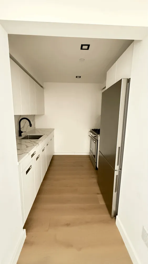 a bathroom with sink and mirror