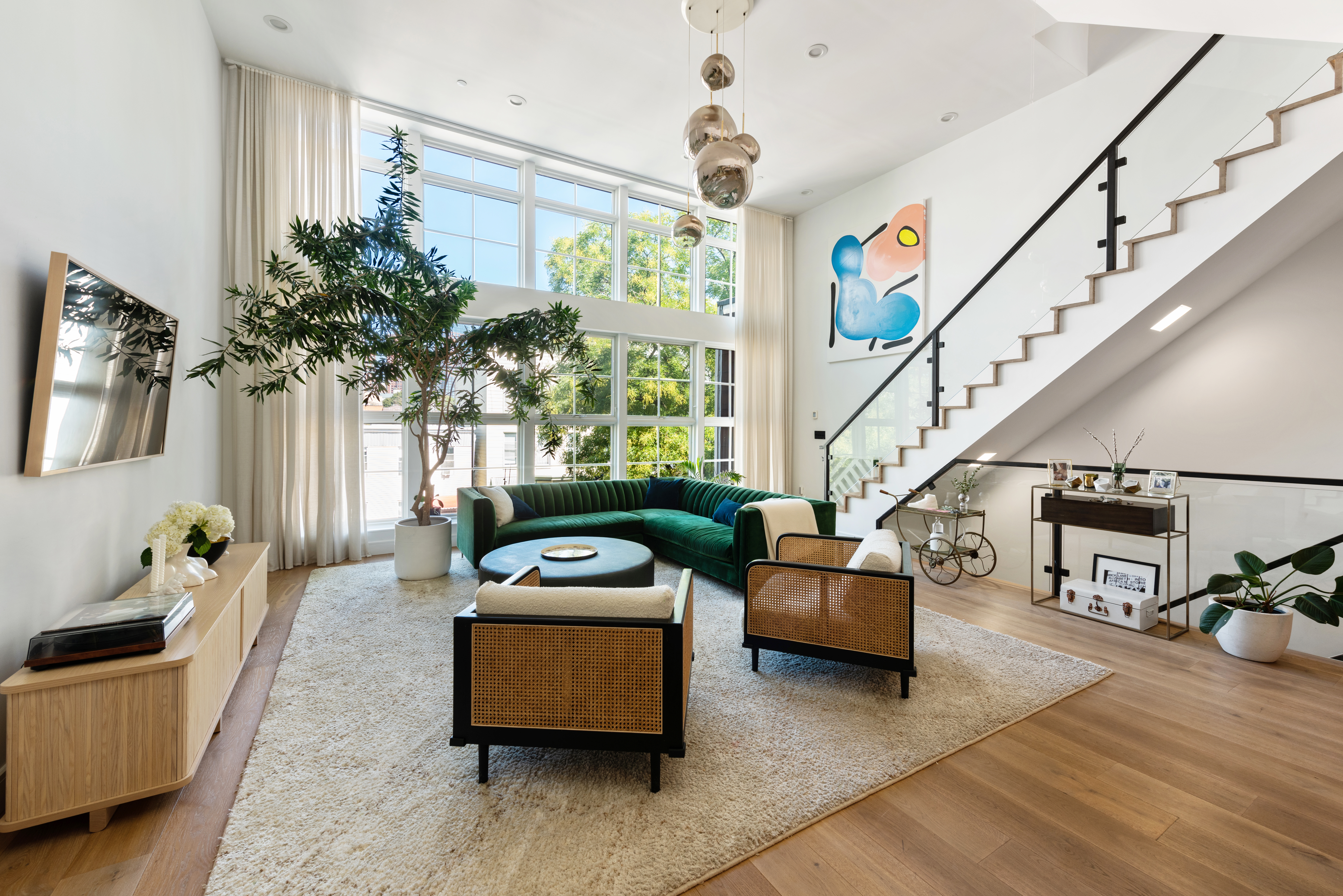 102 Huron Street, Unit 3B Brooklyn, NY 11222 - Photo 1 of 18 a living room with furniture and a potted plant