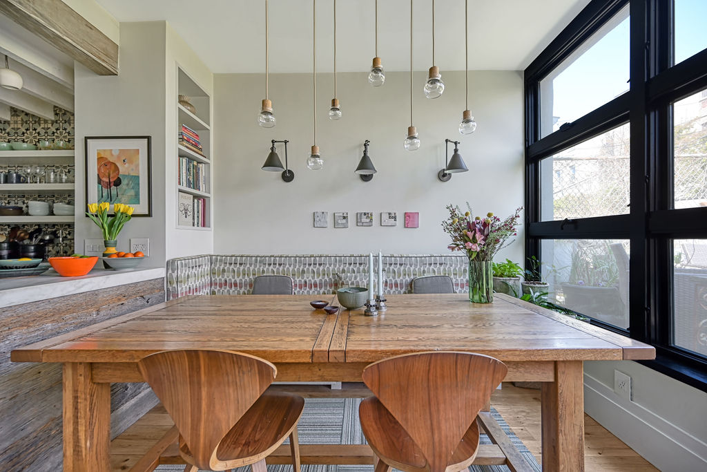 315 15th Street Brooklyn, NY 11215 - Photo 8 of 25 a kitchen with a table chairs and cabinets