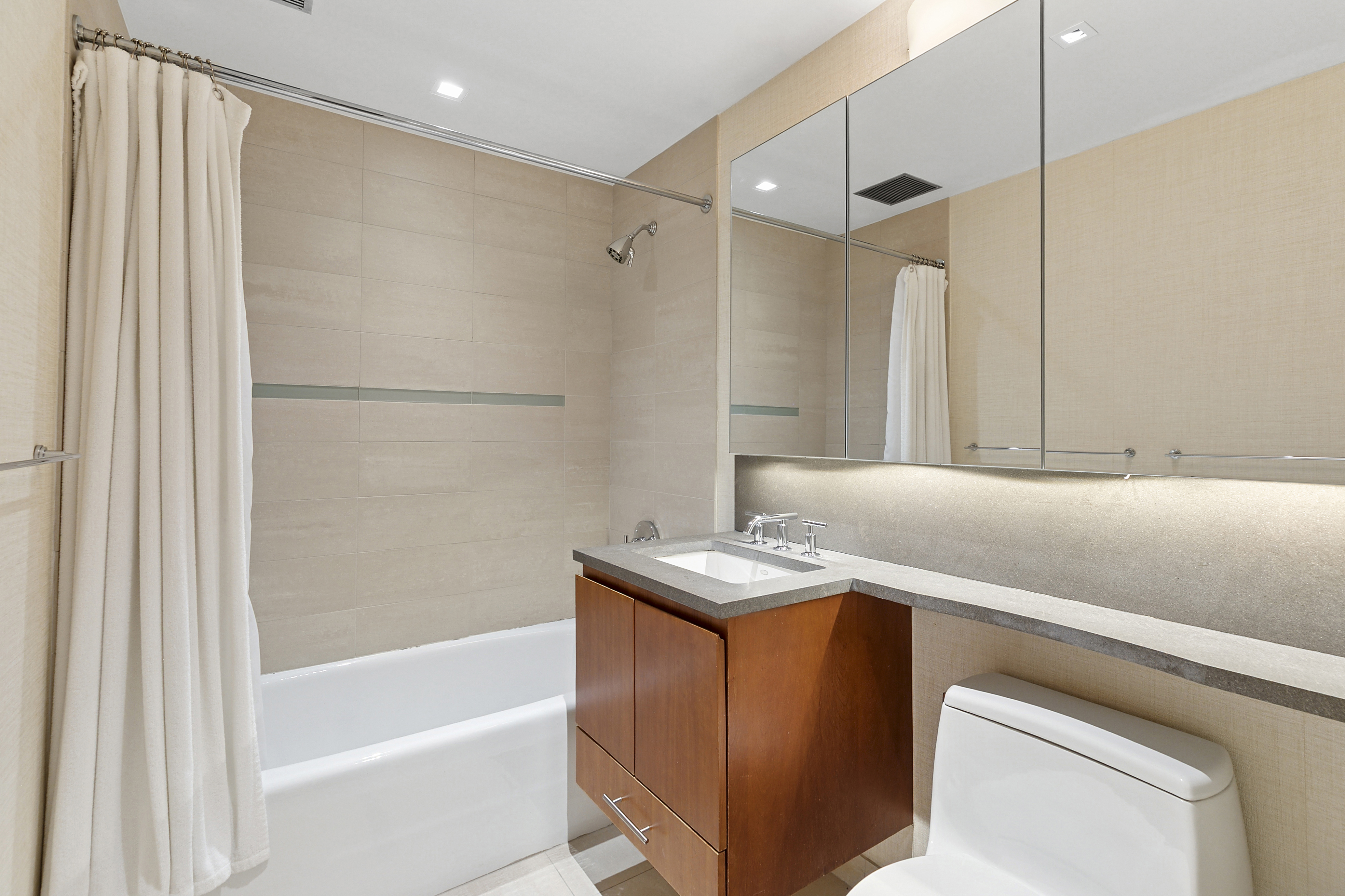 255 Hudson Street, Unit TH1 Manhattan, NY 10013 - Photo 8 of 10 a bathroom with a sink and a mirror