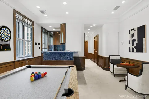 a living room with furniture and flat screen tv