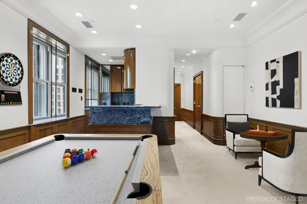 a living room with furniture and flat screen tv