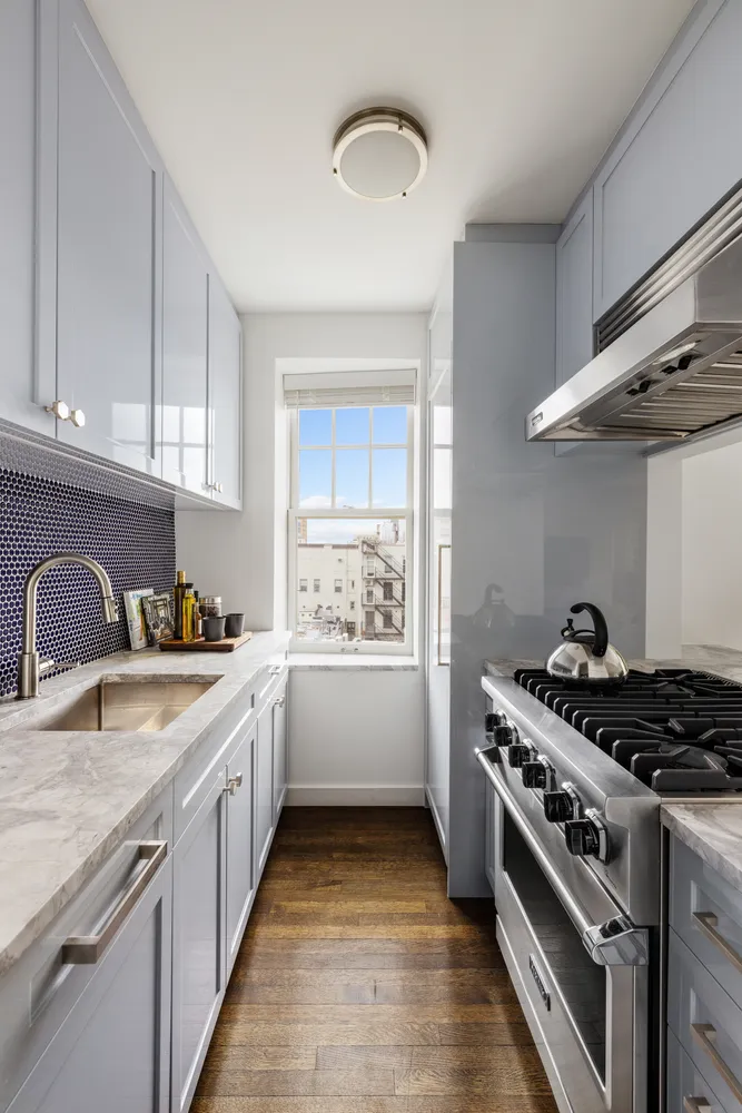 a kitchen that has a lot of cabinets in it