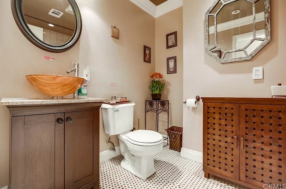 15604 Deblynn Avenue Gardena, CA 90248 - Photo 5 of 22 a bathroom with a toilet a sink and a mirror