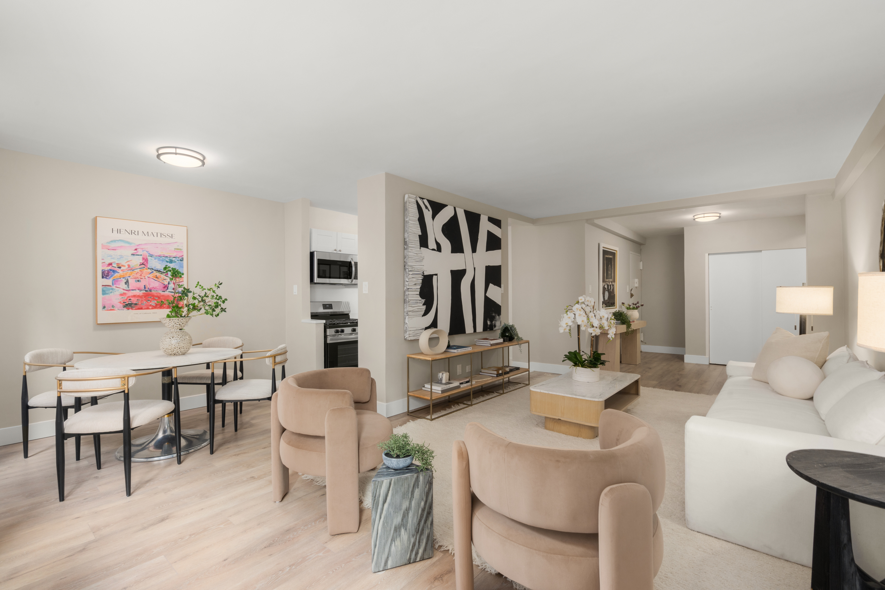 347 East 53rd Street, Unit 2C Manhattan, NY 10022 - Photo 5 of 18 a view of a dining room with furniture and wooden floor