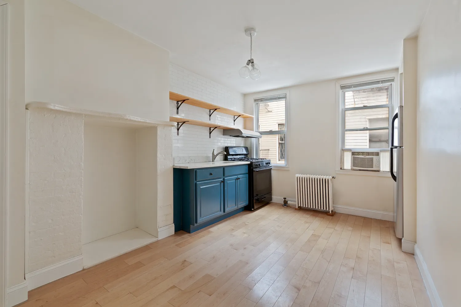 a kitchen with stainless steel appliances a refrigerator and a sink