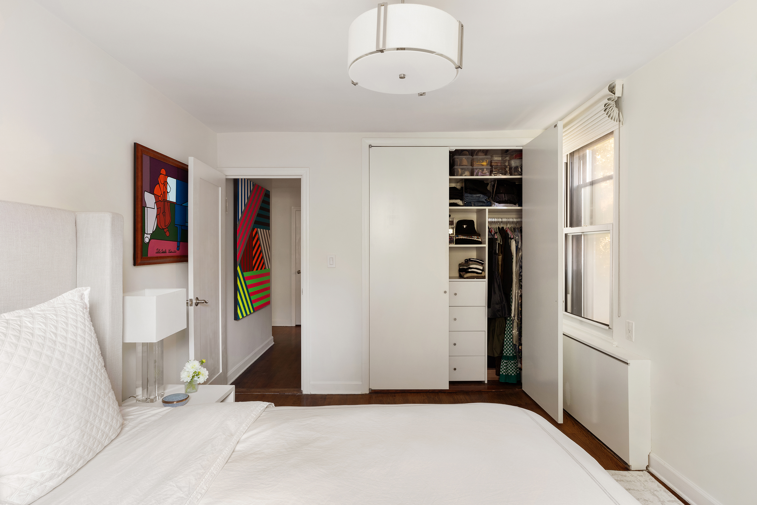 81 Bedford Street, Unit 4B Manhattan, NY 10014 - Photo 8 of 15 a view of an empty room with closet and a window