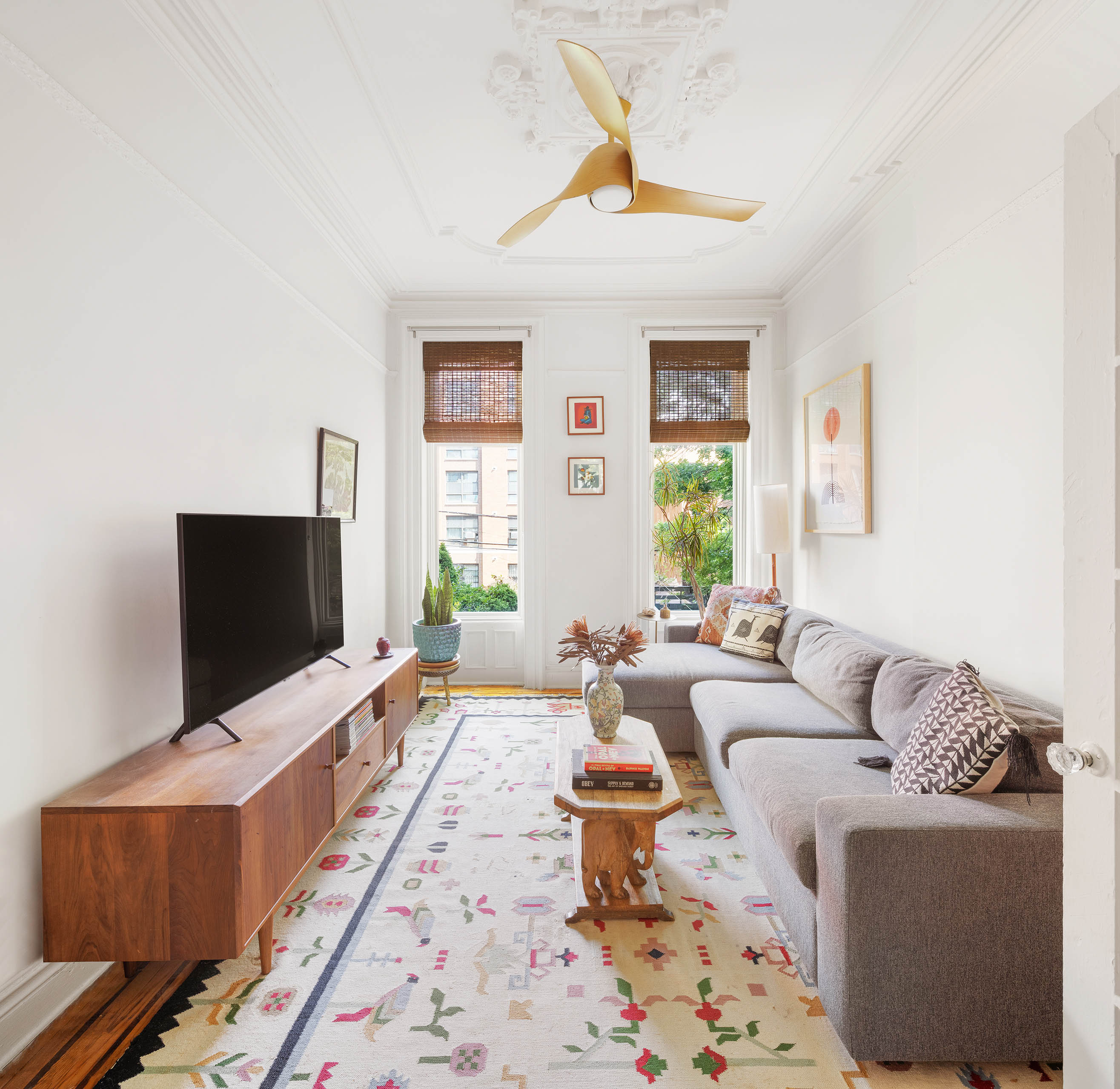 379 Monroe Street Brooklyn, NY 11221 - Photo 6 of 15 a living room with furniture and a flat screen tv