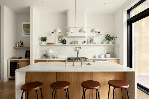 a view of dining table chairs and window
