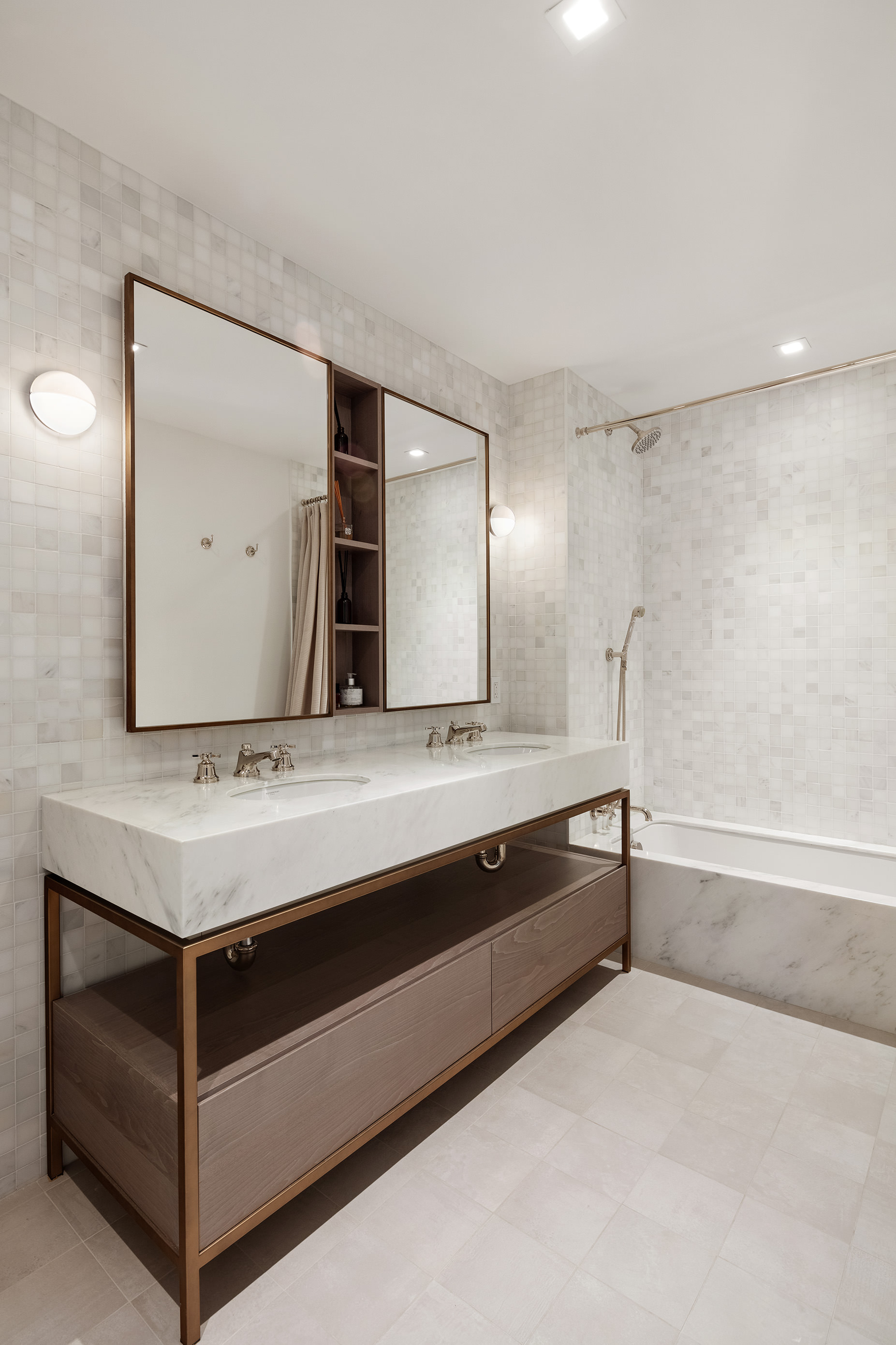 310 East 86th Street, Unit 4B Manhattan, NY 10028 - Photo 15 of 25 a bathroom with a sink and a mirror