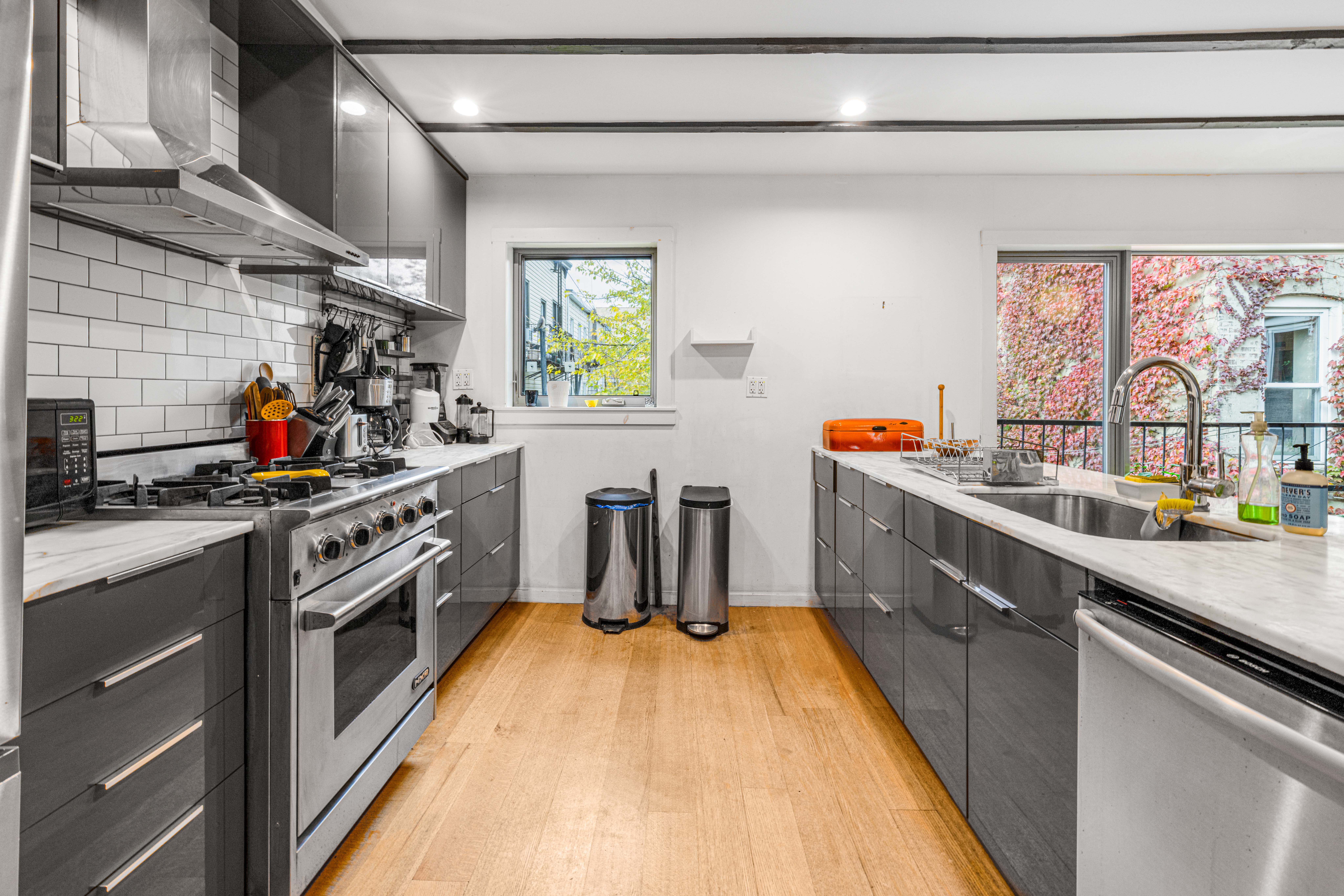 209 Calyer Street, Unit 2 Brooklyn, NY 11222 - Photo 5 of 17 a kitchen with stainless steel appliances a sink a stove and window