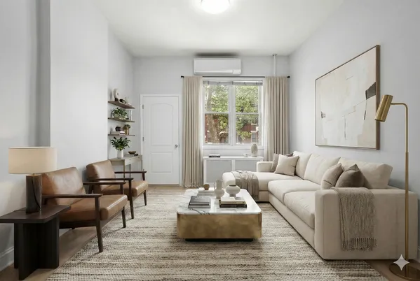 a living room with furniture and a potted plant