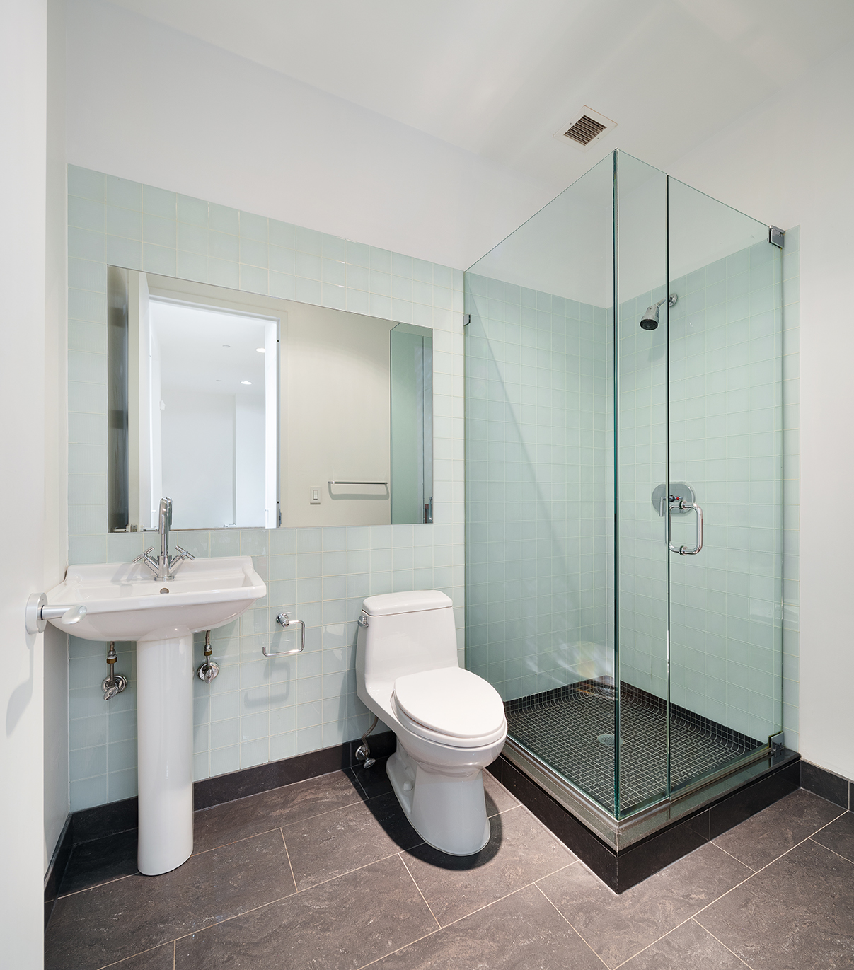 129 Lafayette Street, Unit 3B Manhattan, NY 10013 - Photo 12 of 13 a bathroom with a toilet a sink and shower