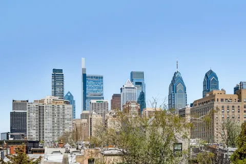 a living room with furniture and a stairs