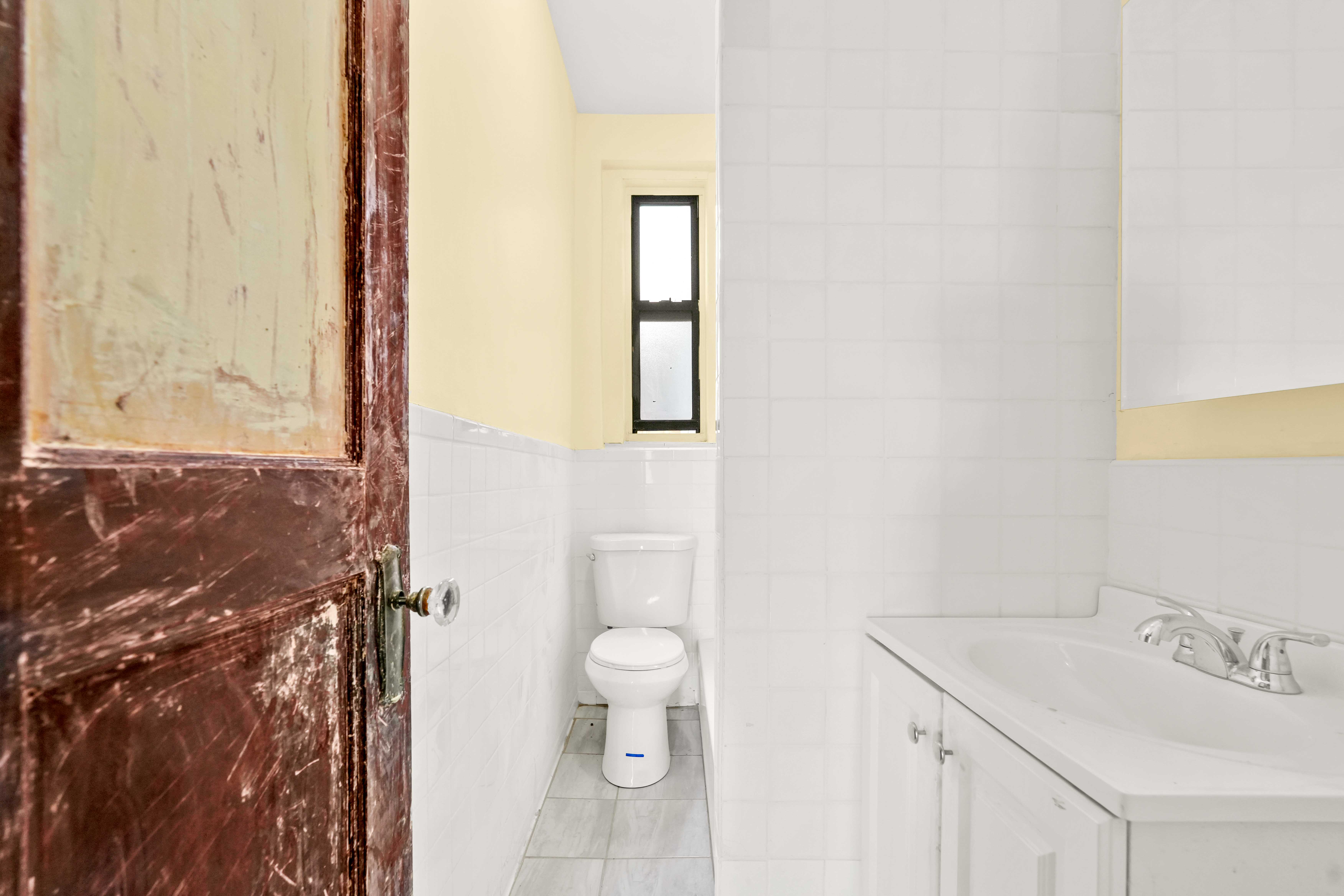 1770 Bedford Avenue Brooklyn, NY 11225 - Photo 18 of 50 a bathroom with a sink and toilet