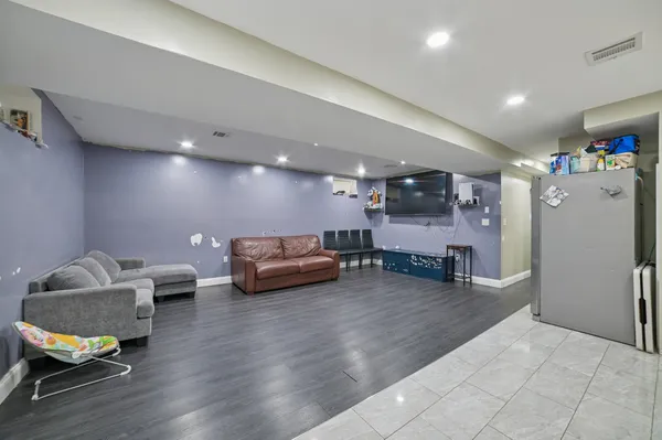 a room with furniture and a wooden floor