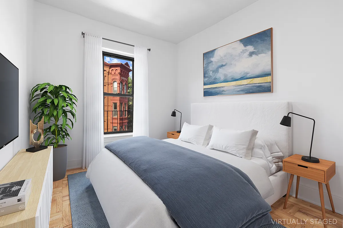 532 10th Street, Unit 1 Brooklyn, NY 11215 - Photo 3 of 6 a bedroom with a bed and a window