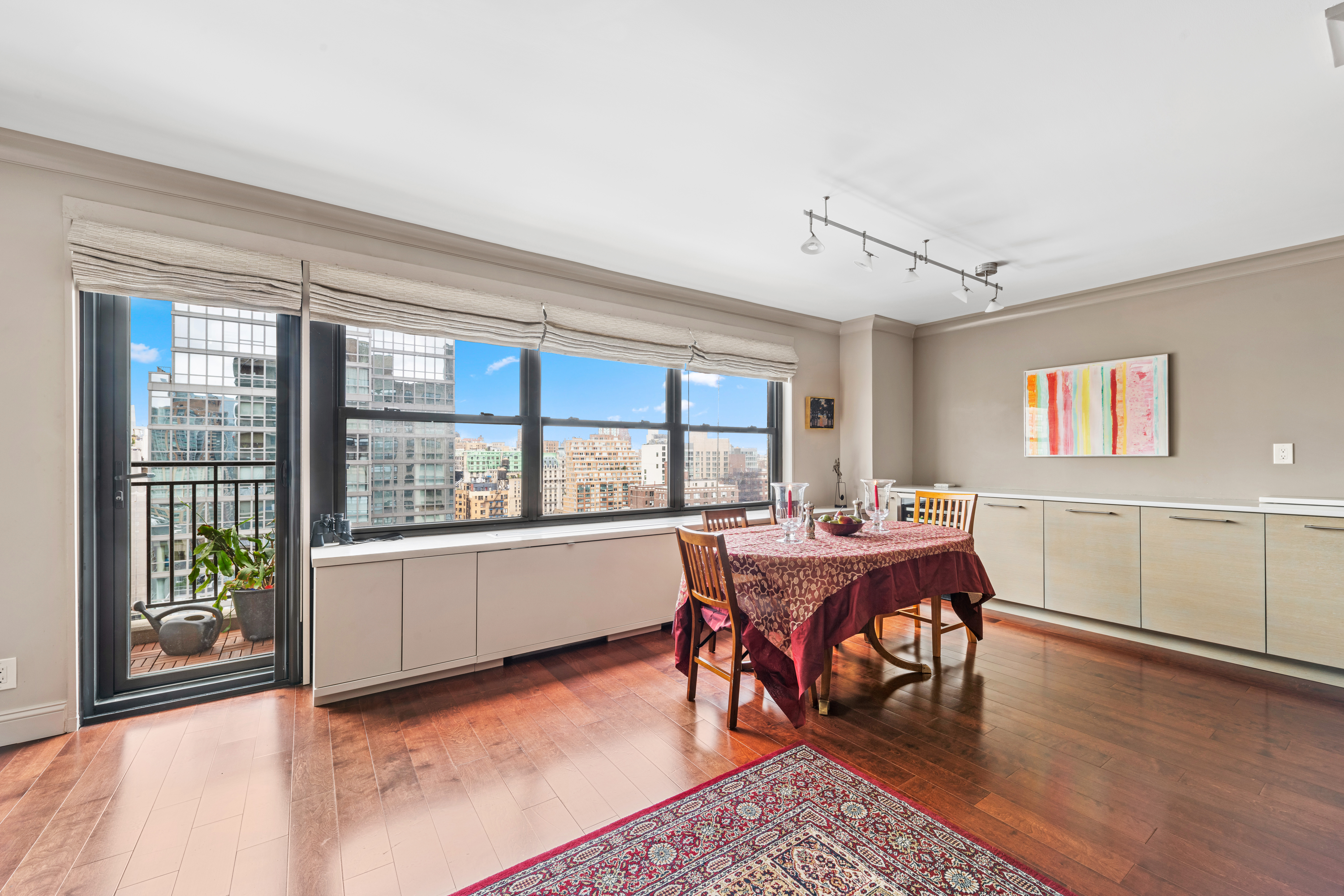 180 West End Avenue, Unit 25M Manhattan, NY 10023 - Photo 3 of 11 a view of a dining room with furniture window and wooden floor