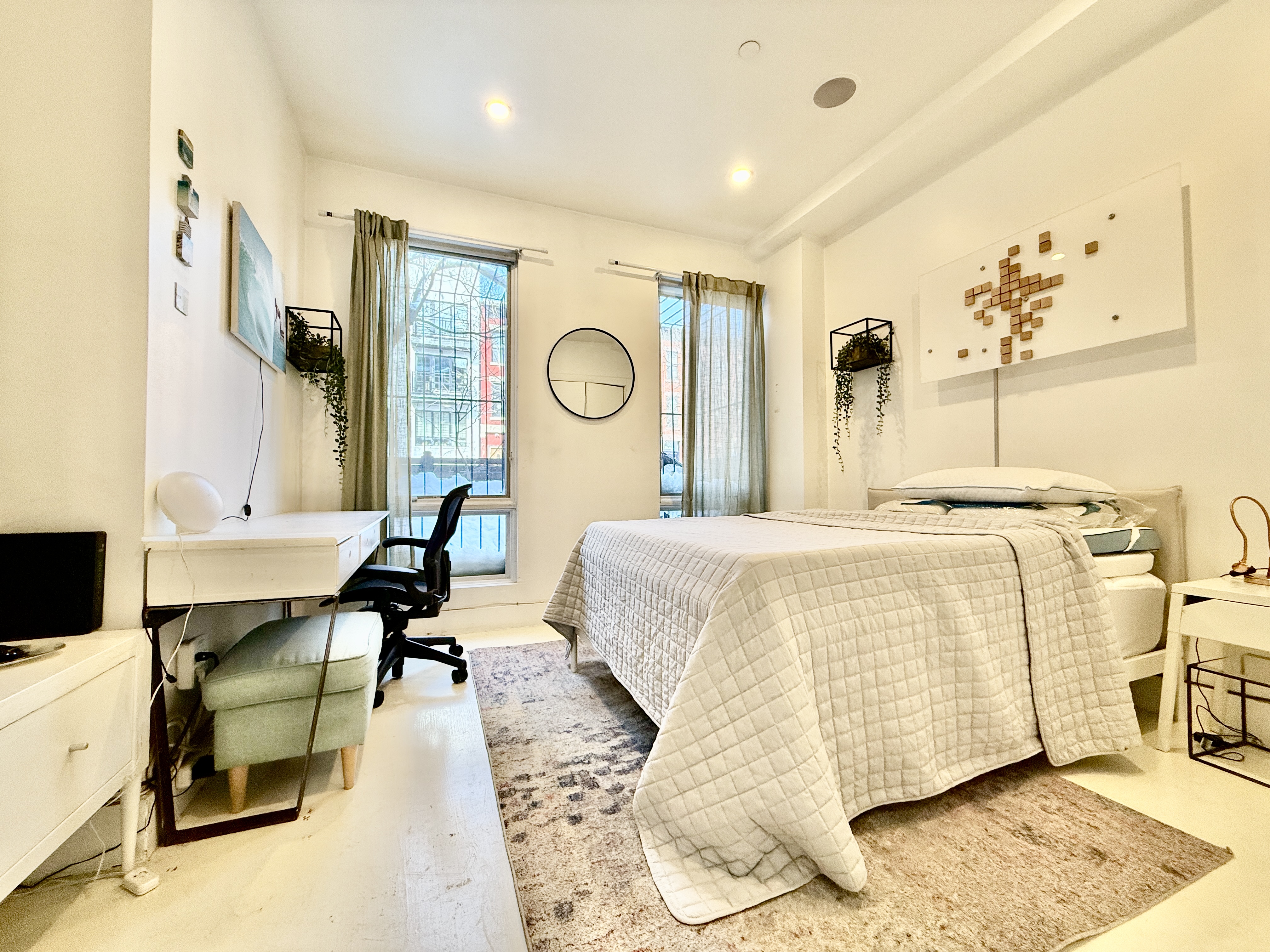 668 Halsey Street, Unit 1 Brooklyn, NY 11233 - Photo 8 of 14 a bedroom with a bed and wooden floor