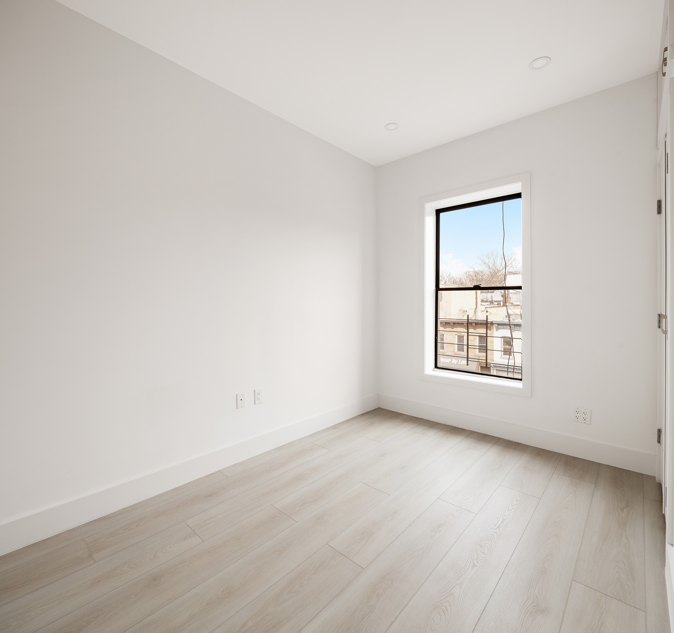 392 5th Avenue, Unit 3A Brooklyn, NY 11215 - Photo 7 of 9 an empty room with wooden floor and windows