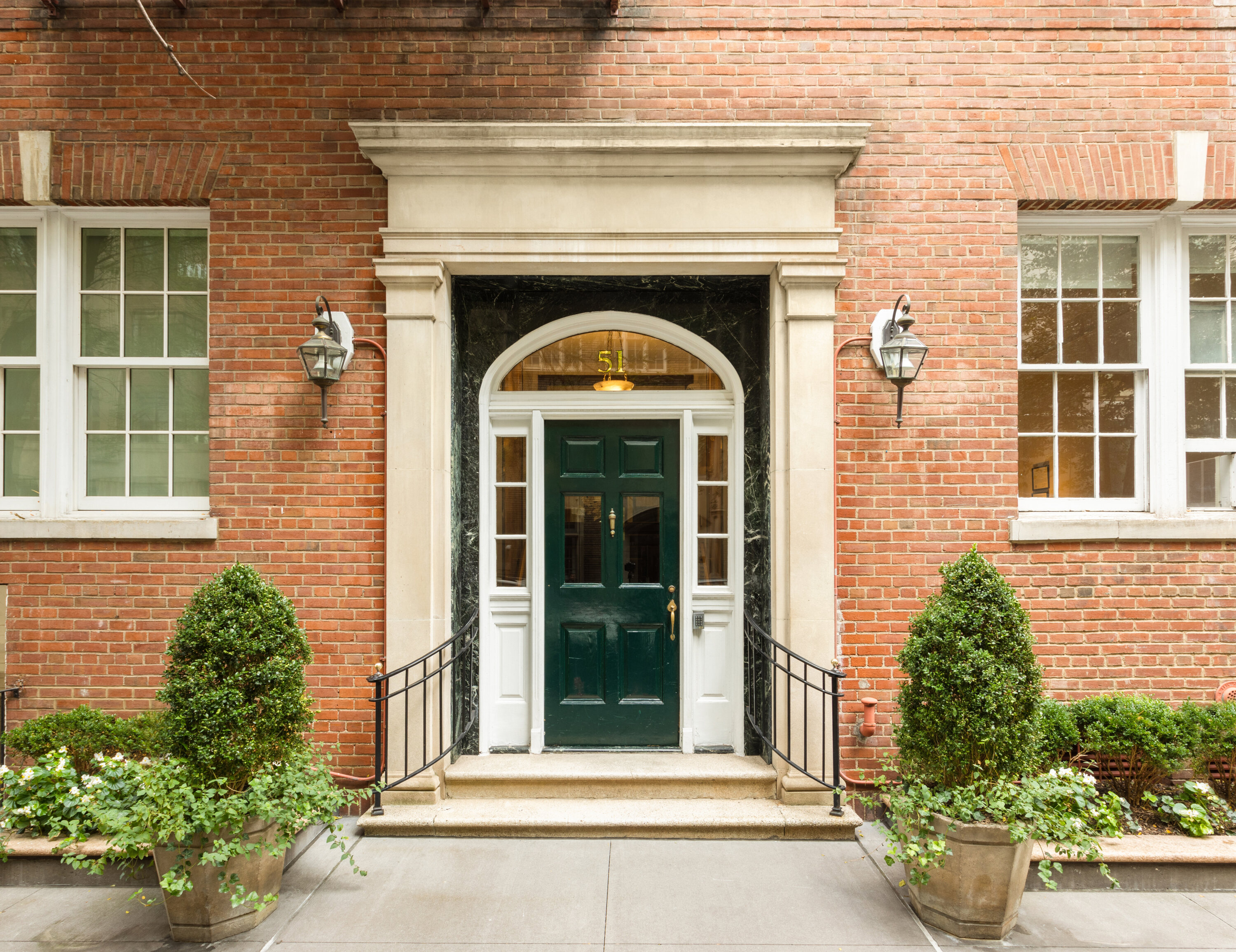51 East 78th Street, Unit 3BC Manhattan, NY 10075 - Photo 22 of 25 a front view of a house with plants