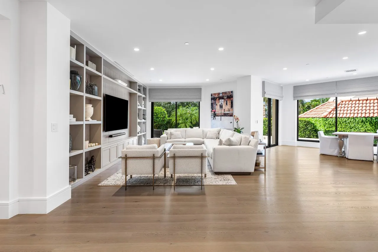 a living room with fireplace furniture and a flat screen tv