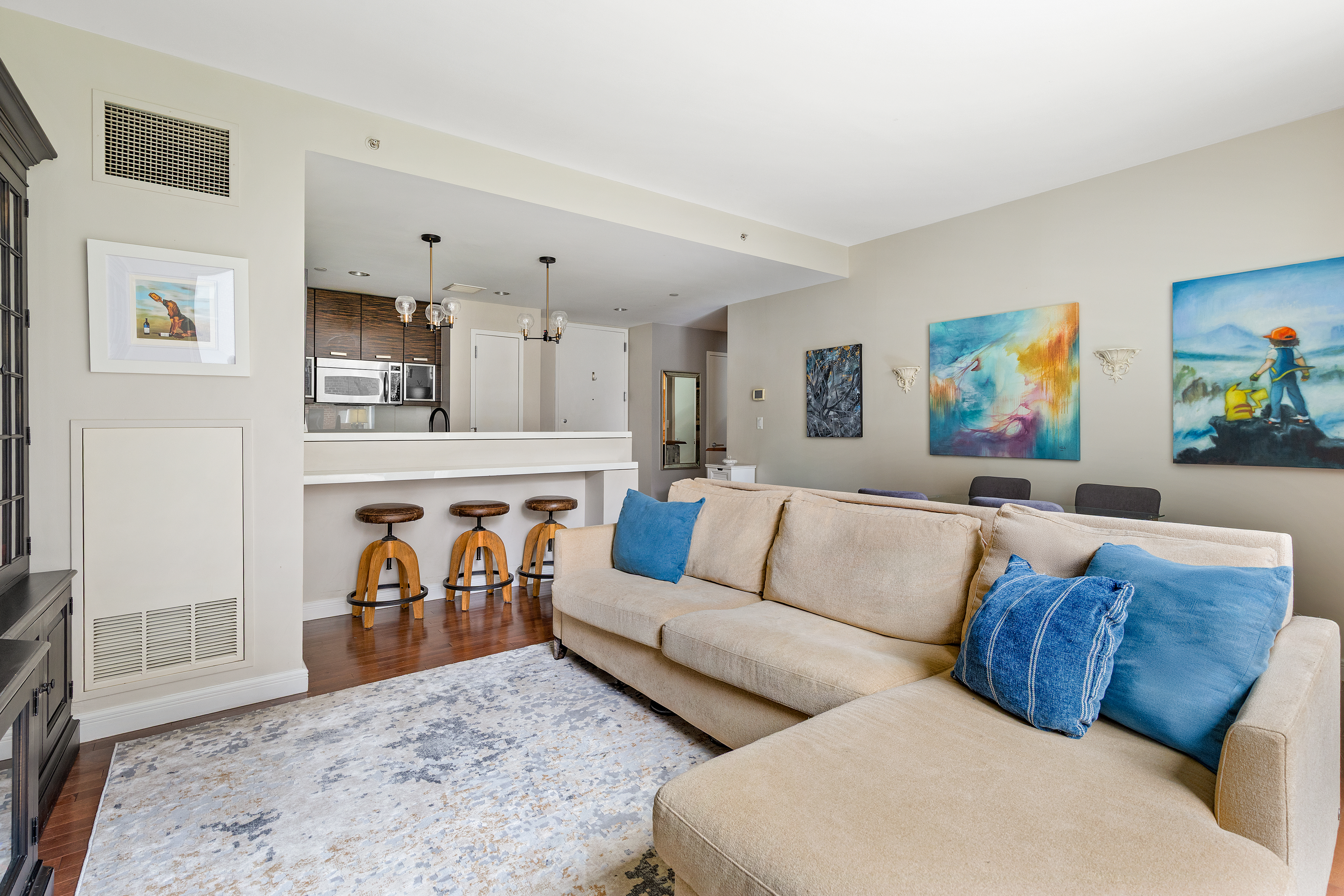 225 East 34th Street, Unit 3K Manhattan, NY 10016 - Photo 3 of 19 a living room with furniture and painting on the wall
