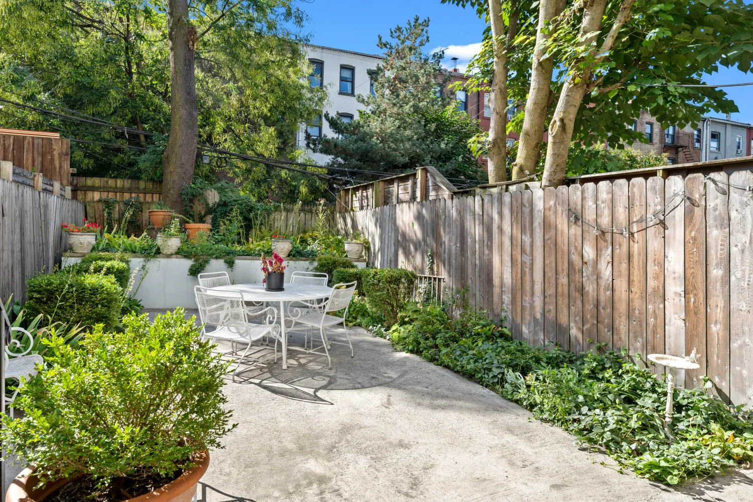 a view of a chair and table in backyard