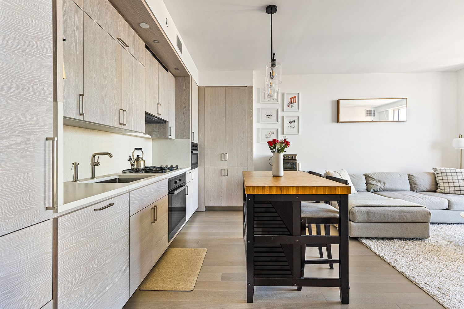 1 City Point, Unit 36D Brooklyn, NY 11201 - Photo 2 of 16 a kitchen with stainless steel appliances granite countertop a sink stove and cabinets