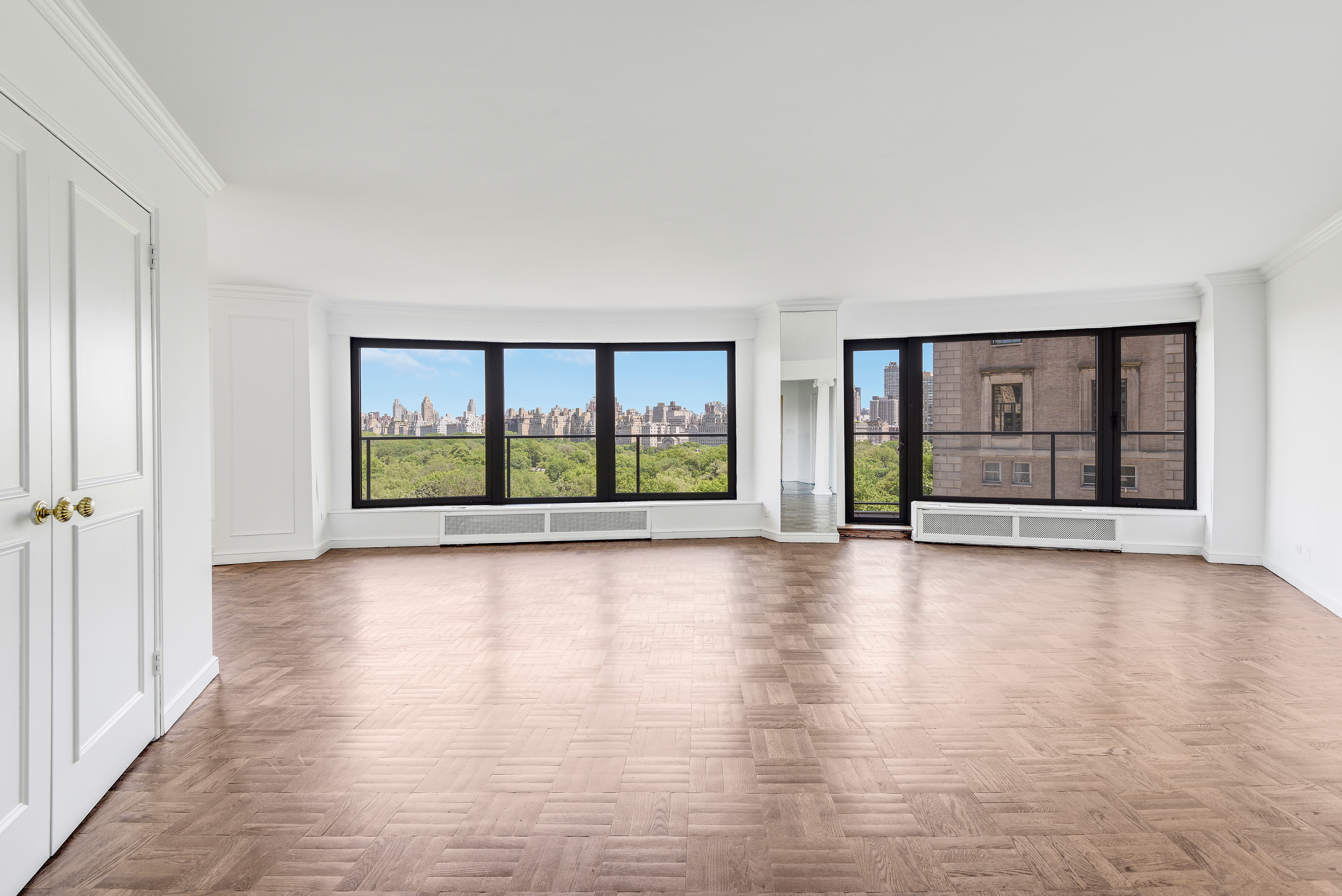 200 Central Park South, Unit 14B Manhattan, NY 10019 - Photo 9 of 17 wooden floor in an empty room with a fireplace