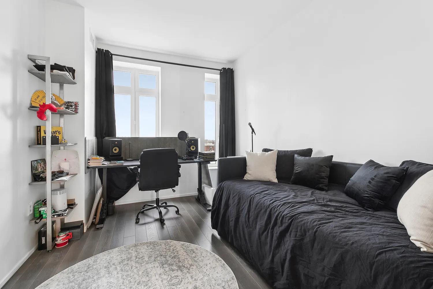 a living room with furniture and wooden floor