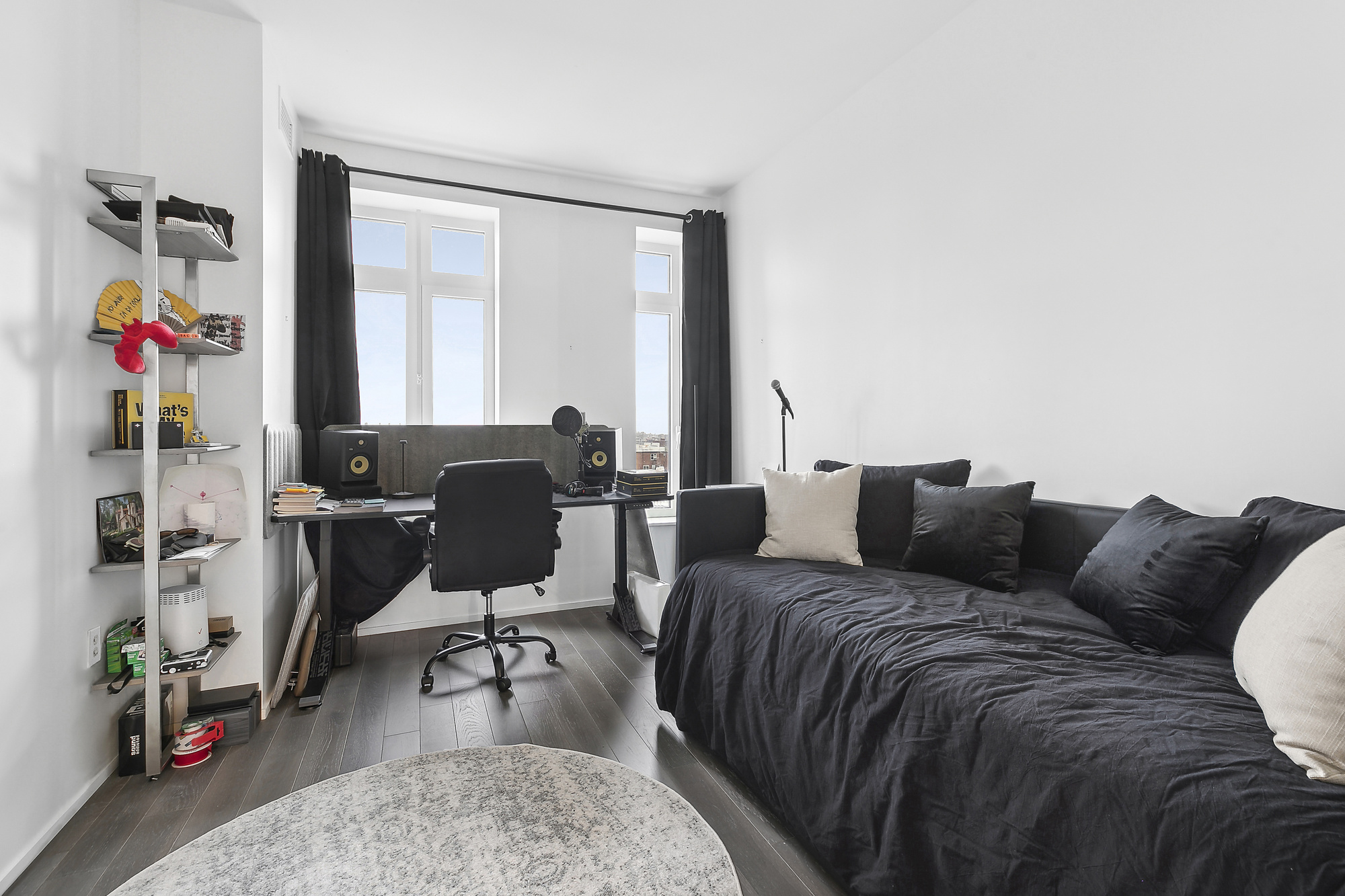 543 West 122nd Street, Unit 17C Manhattan, NY 10027 - Photo 8 of 10 a living room with furniture and wooden floor