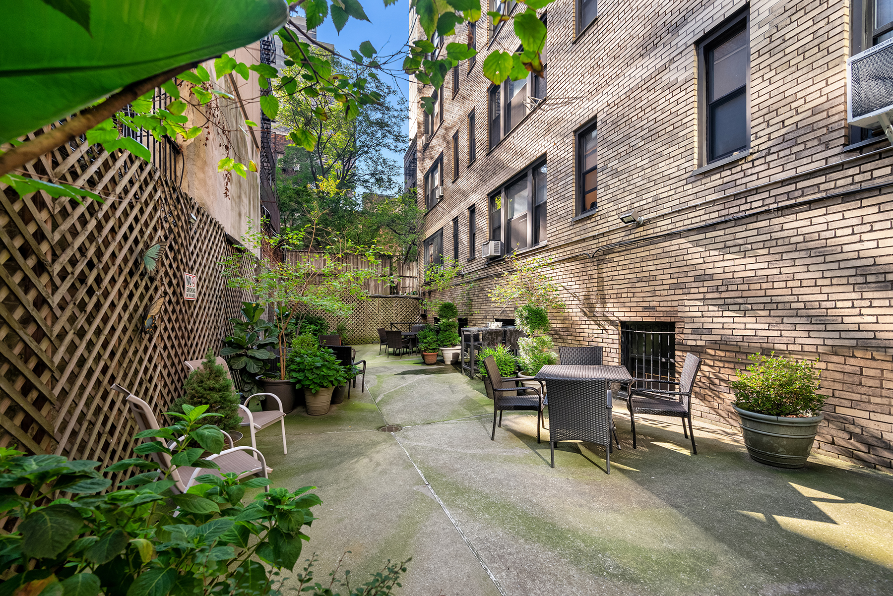 339 East 58th Street, Unit 3J Manhattan, NY 10022 - Photo 7 of 9 a view of a patio with plants and chairs