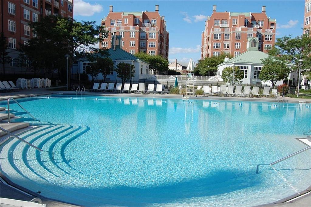 135 Oceana Drive East, Unit 2C Brooklyn, NY 11235 - Photo 27 of 29 a view of a swimming pool with outdoor seating