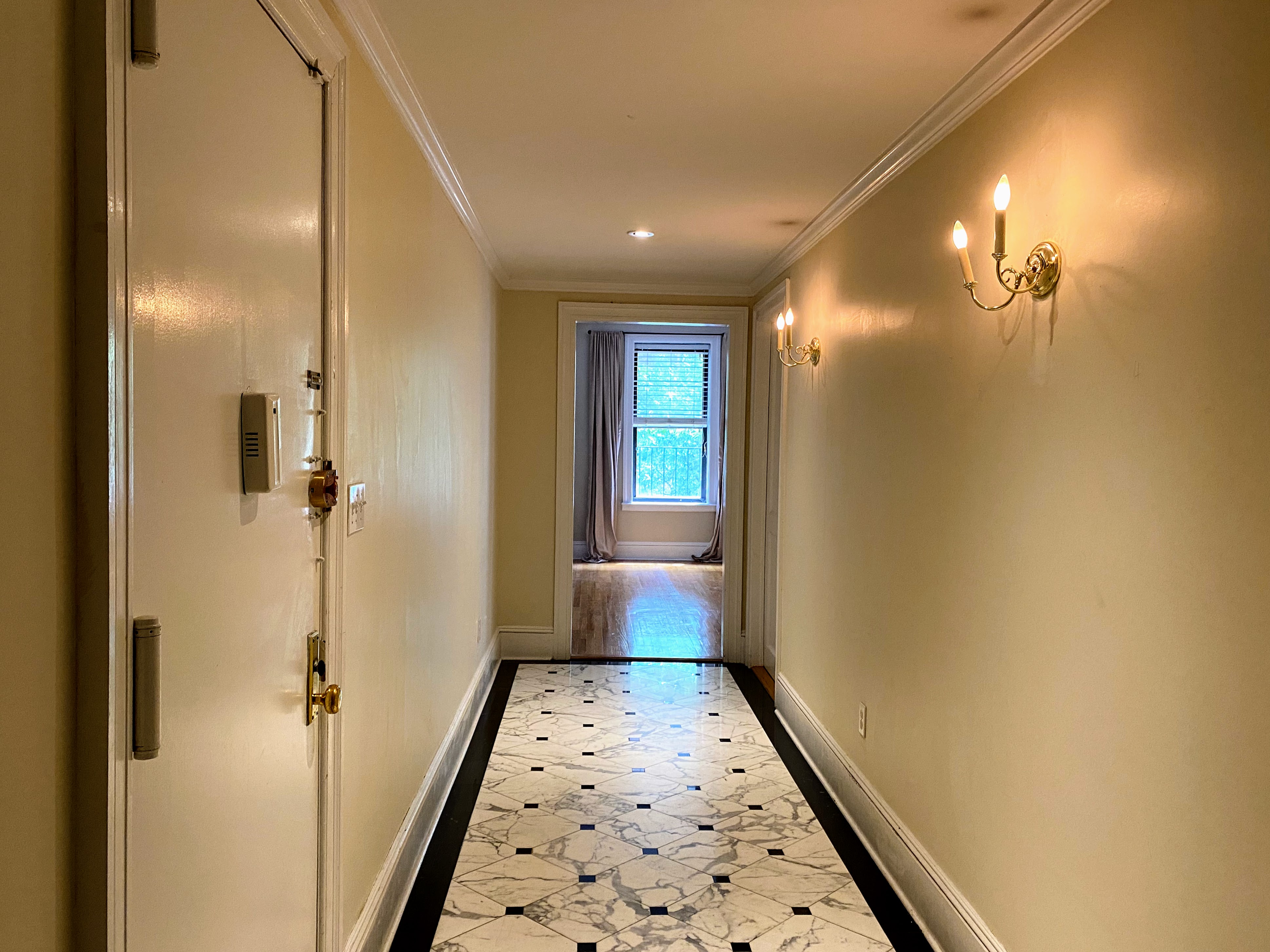 1240 Park Avenue, Unit 3B Manhattan, NY 10128 - Photo 8 of 12 a bathroom with a sink and a shower