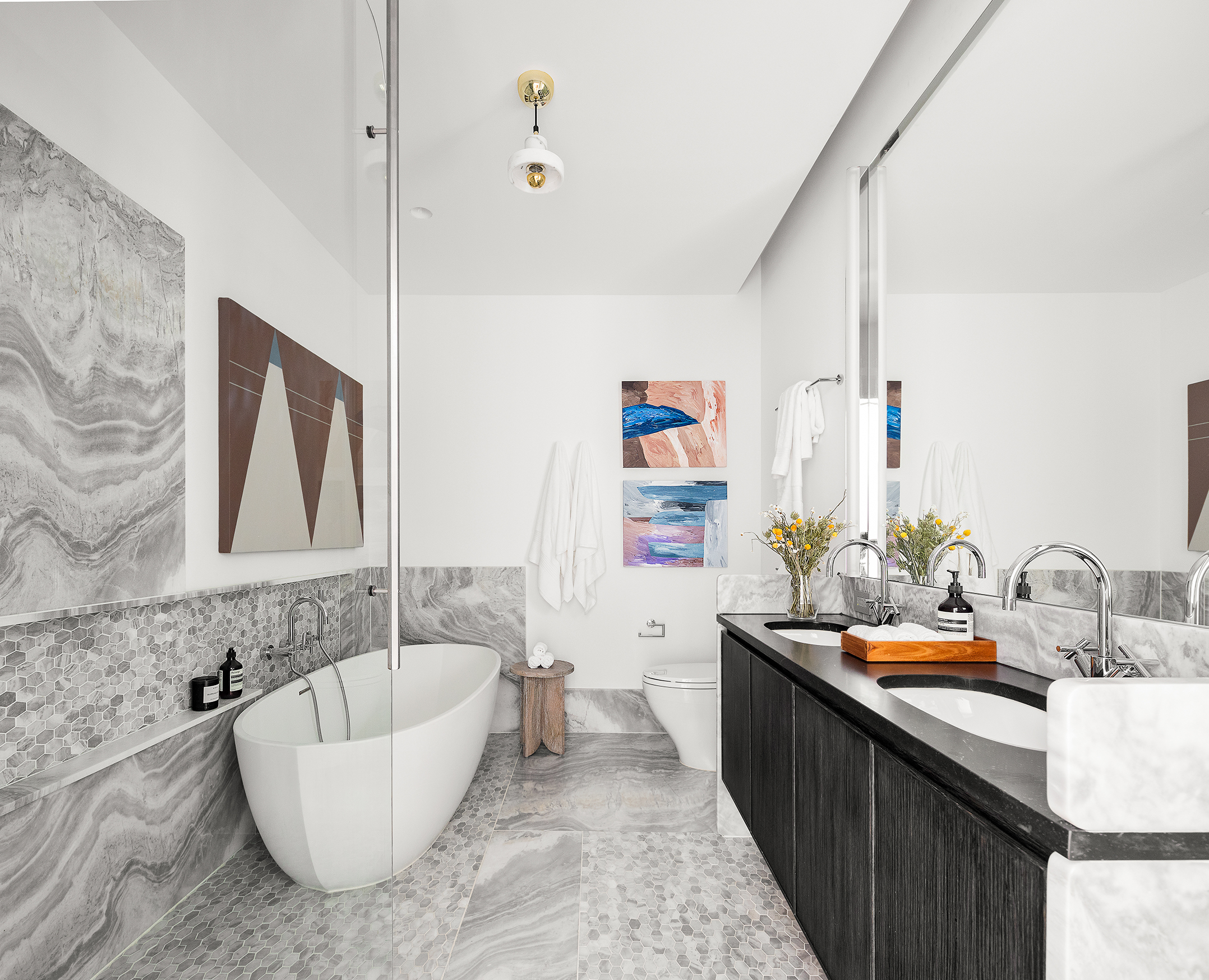 325 West Broadway, Unit 4B Manhattan, NY 10013 - Photo 9 of 17 a bathroom with a tub sink and mirror