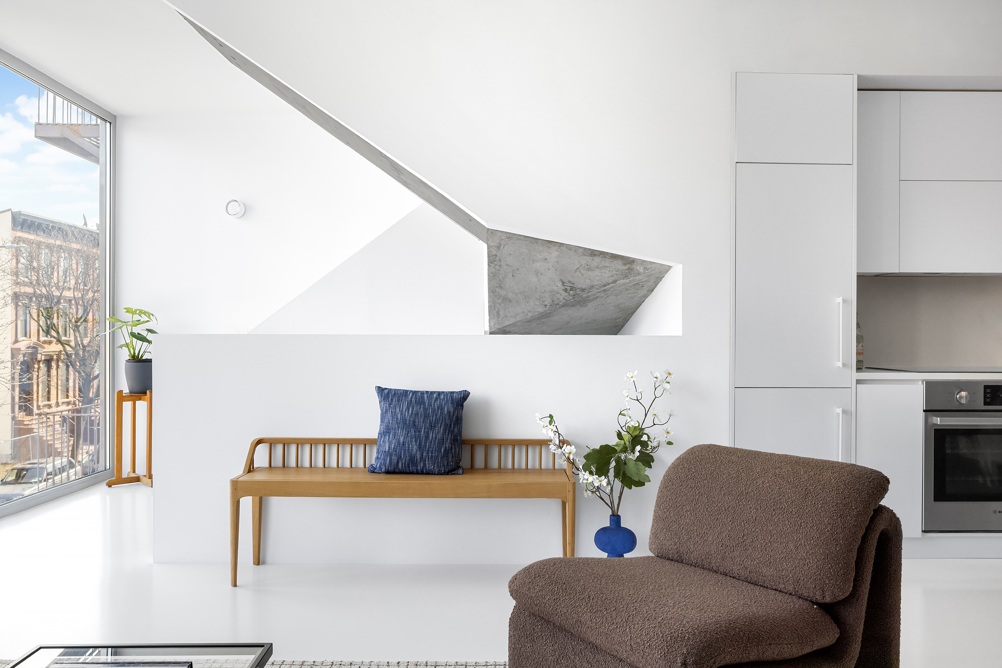 272 Greene Avenue Brooklyn, NY 11238 - Photo 11 of 22 a living room with furniture and a potted plant