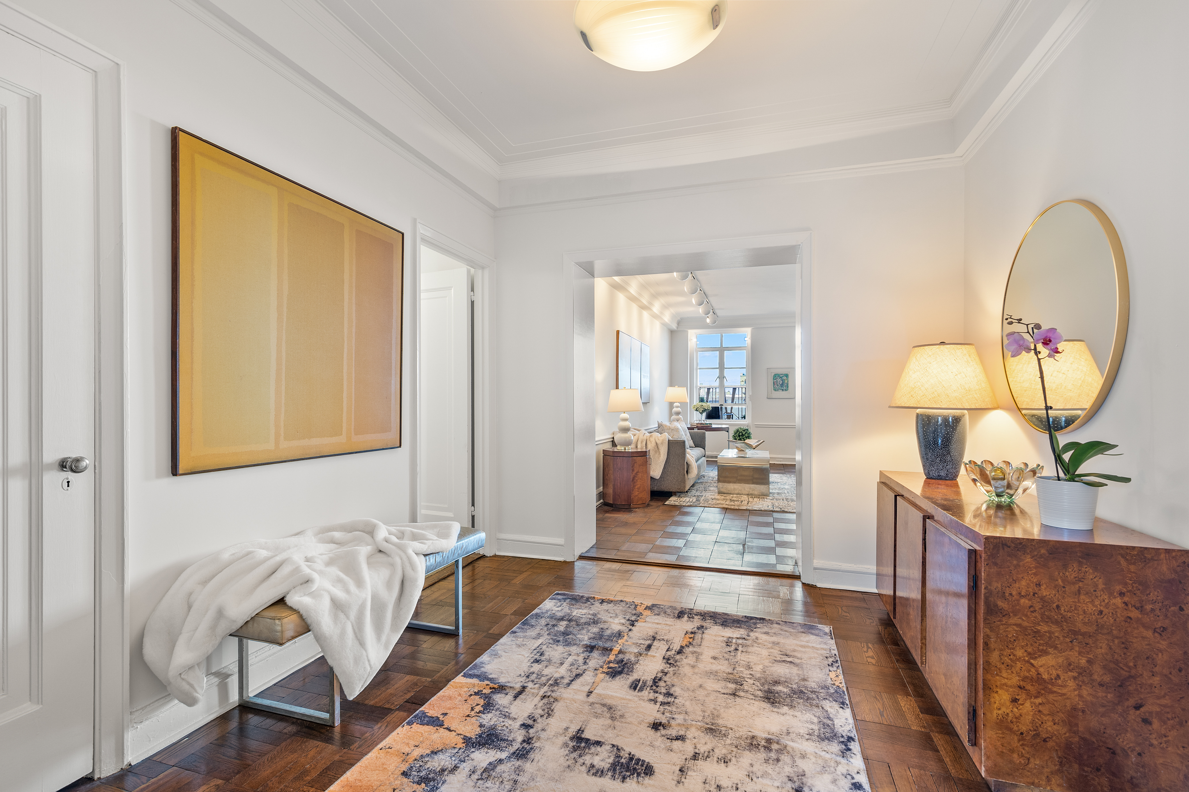 115 Central Park West, Unit 16H Manhattan, NY 10023 - Photo 11 of 30 a living room with furniture and a potted plant