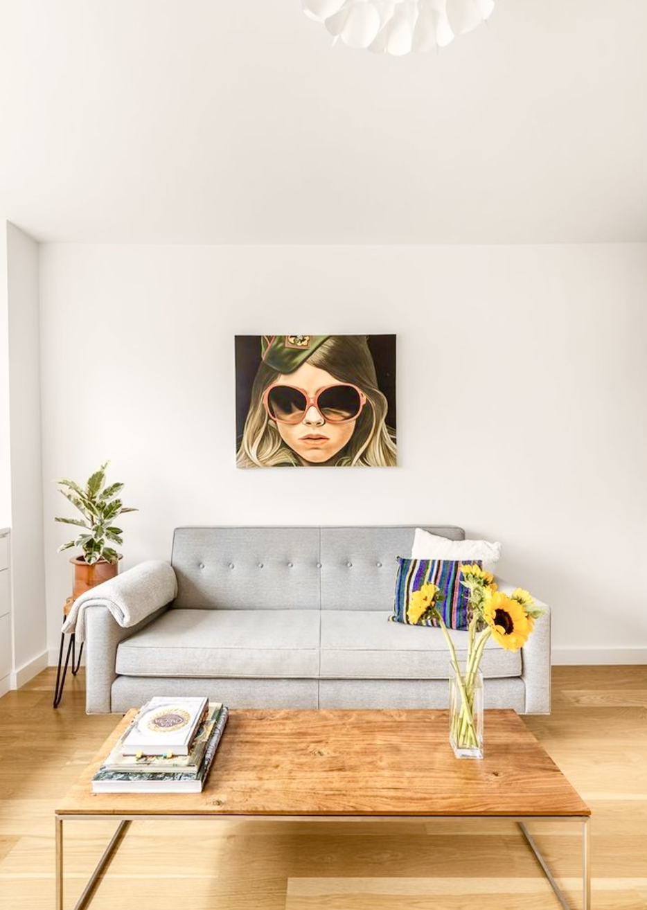 15 Charles Street, Unit 6G Manhattan, NY 10014 - Photo 3 of 14 a living room with a couch and a potted plant