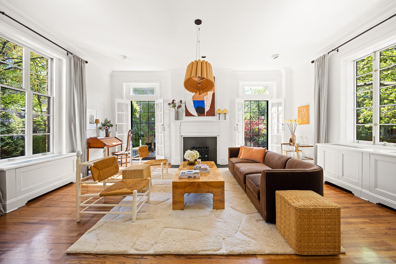 167 Clinton Street, Unit 3 Brooklyn, NY 11201 - Photo 1 of 31 a living room with furniture a fireplace and a large window